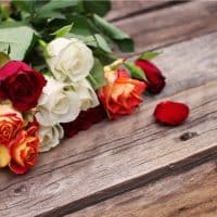 colorful roses on wooden table