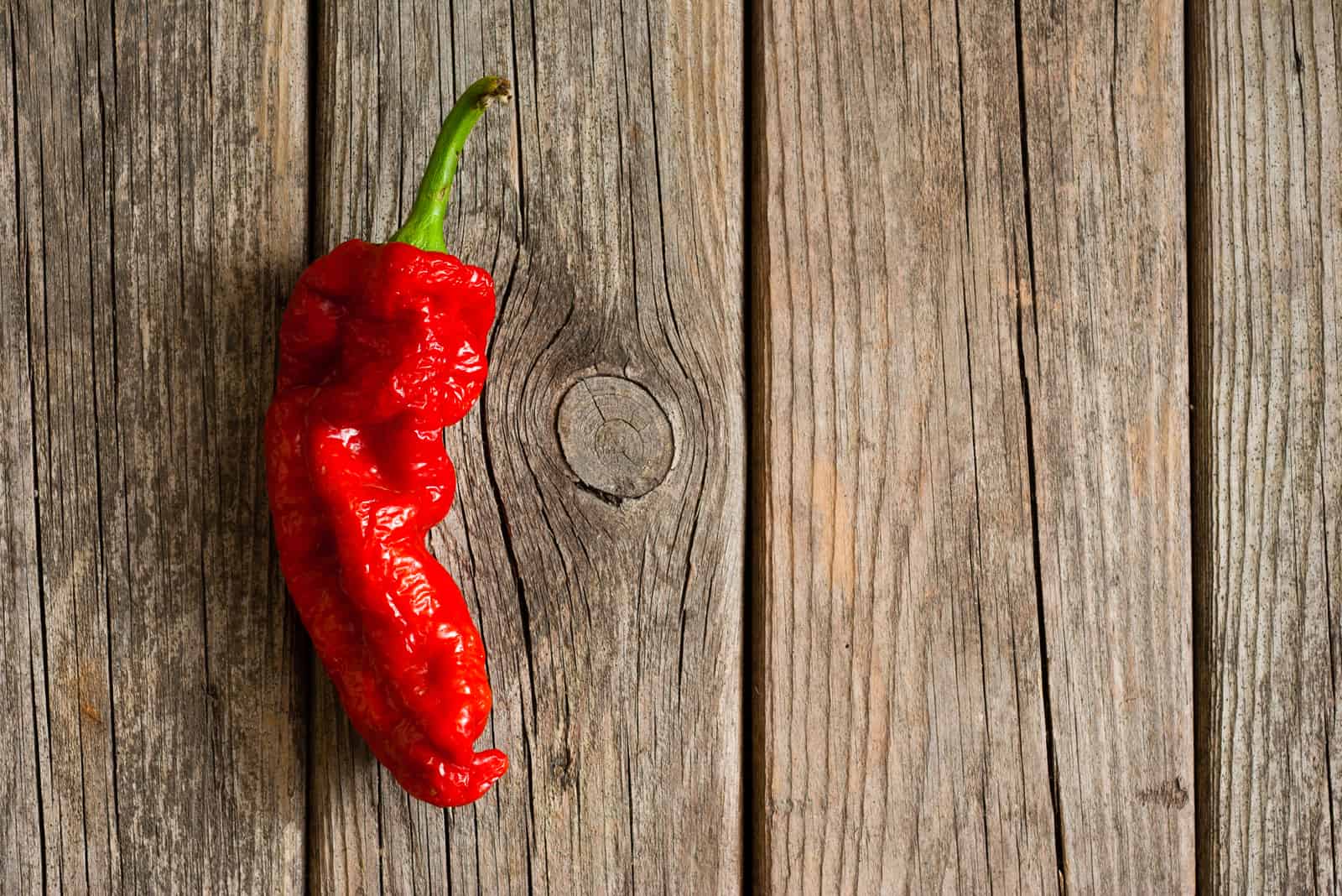 ghost pepper on a wooden table