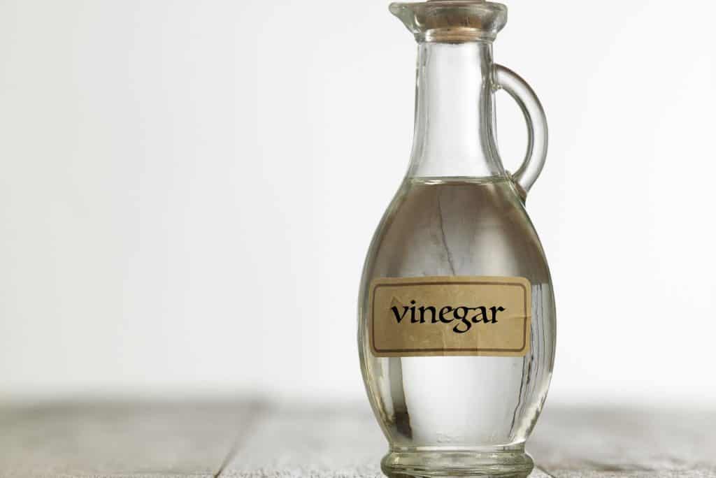 white vinegar on the wooden table top