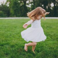 girl dancing on grass