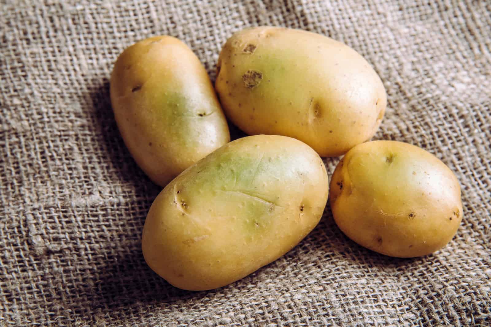 sick potatoes on a brown bag