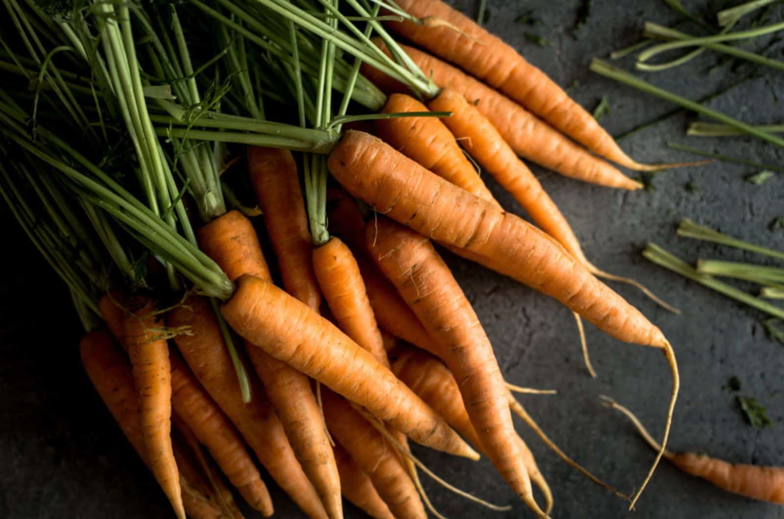 Organic Nantes Carrots on Rustic Dark Background