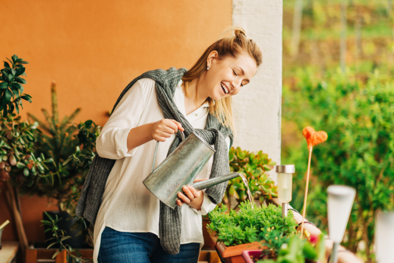 smiling woman baying flowers