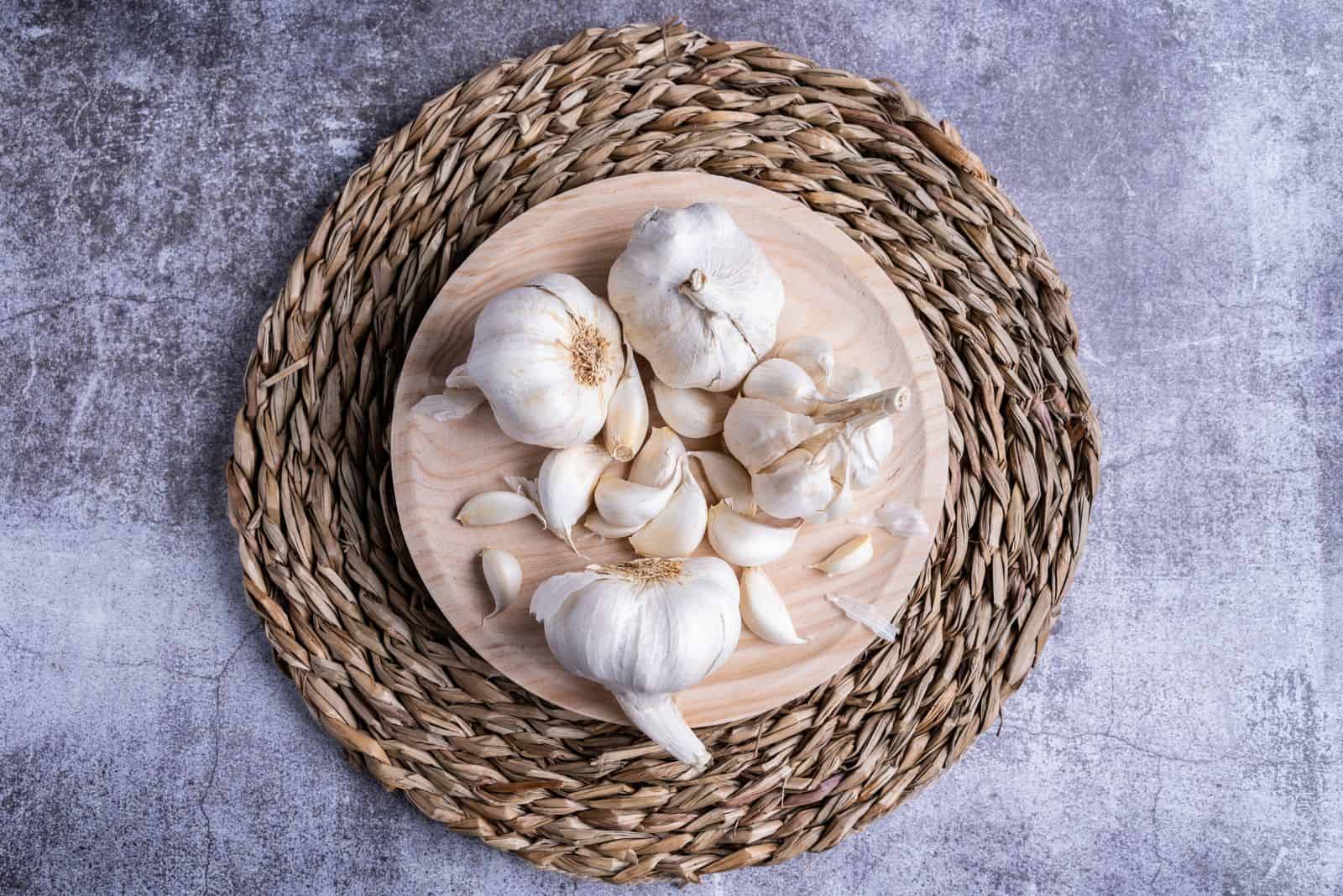 white garlic on a special board