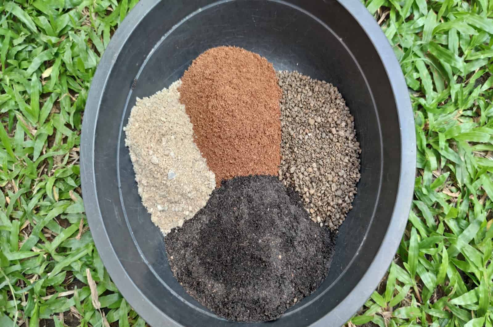 mixing Soil in grey pot