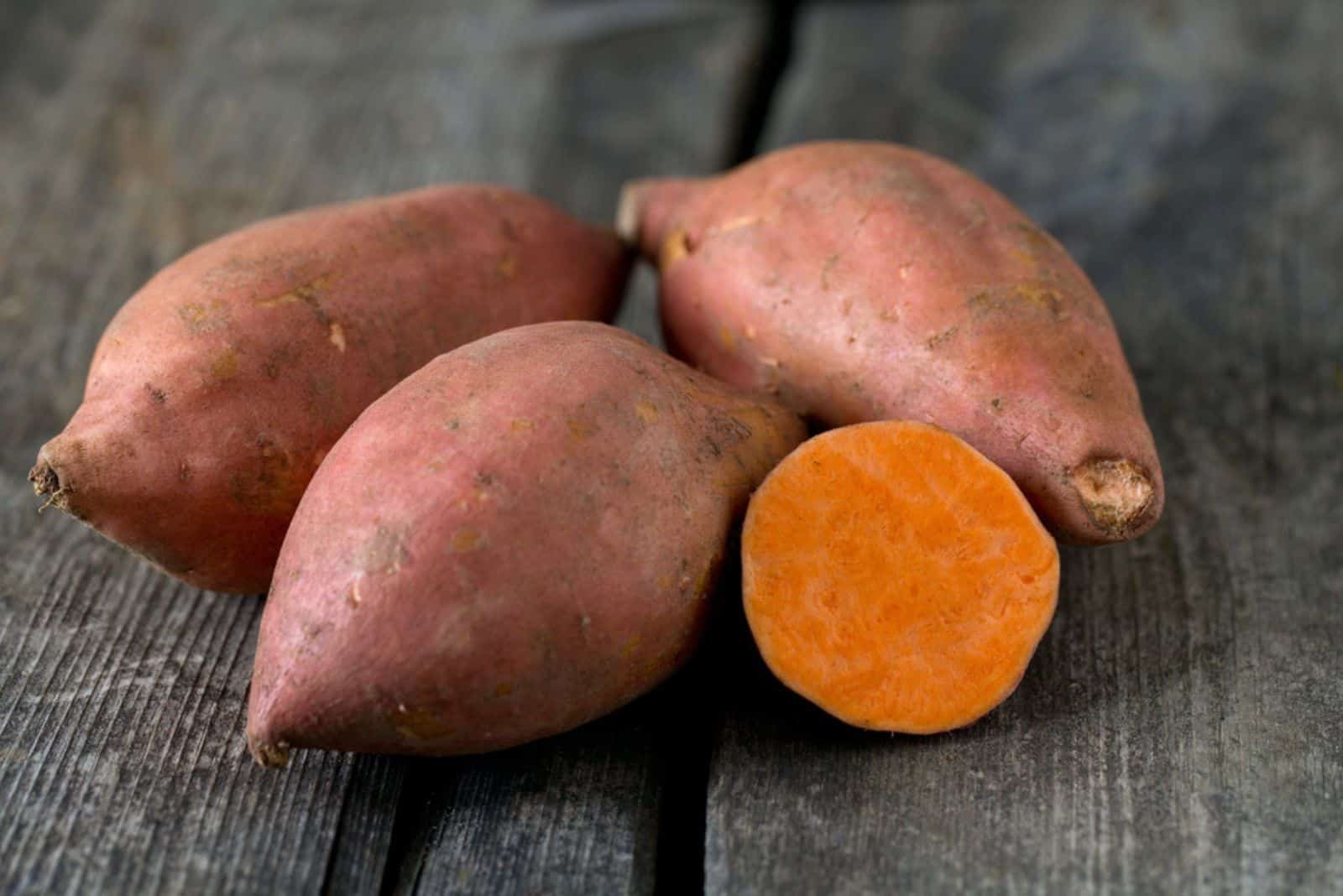 sweet potato on wooden surface