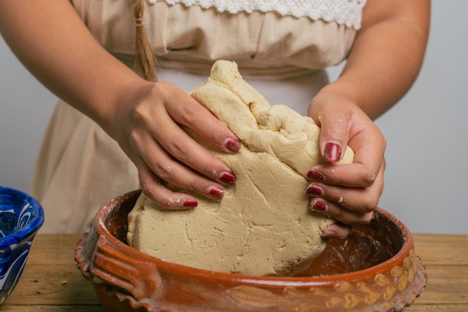 Person doughing nixtamalized corn