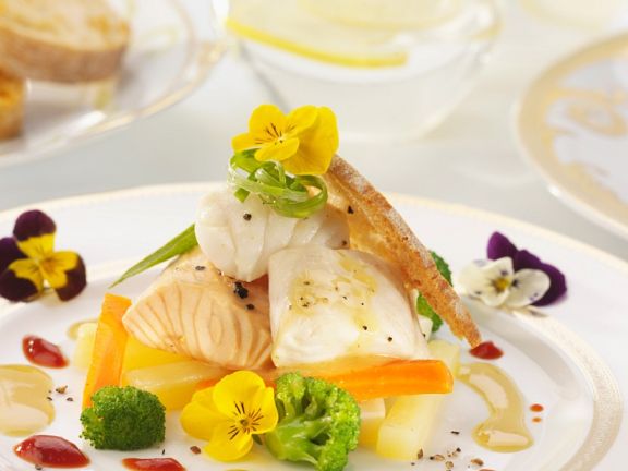 white fish with broccoli and flowers