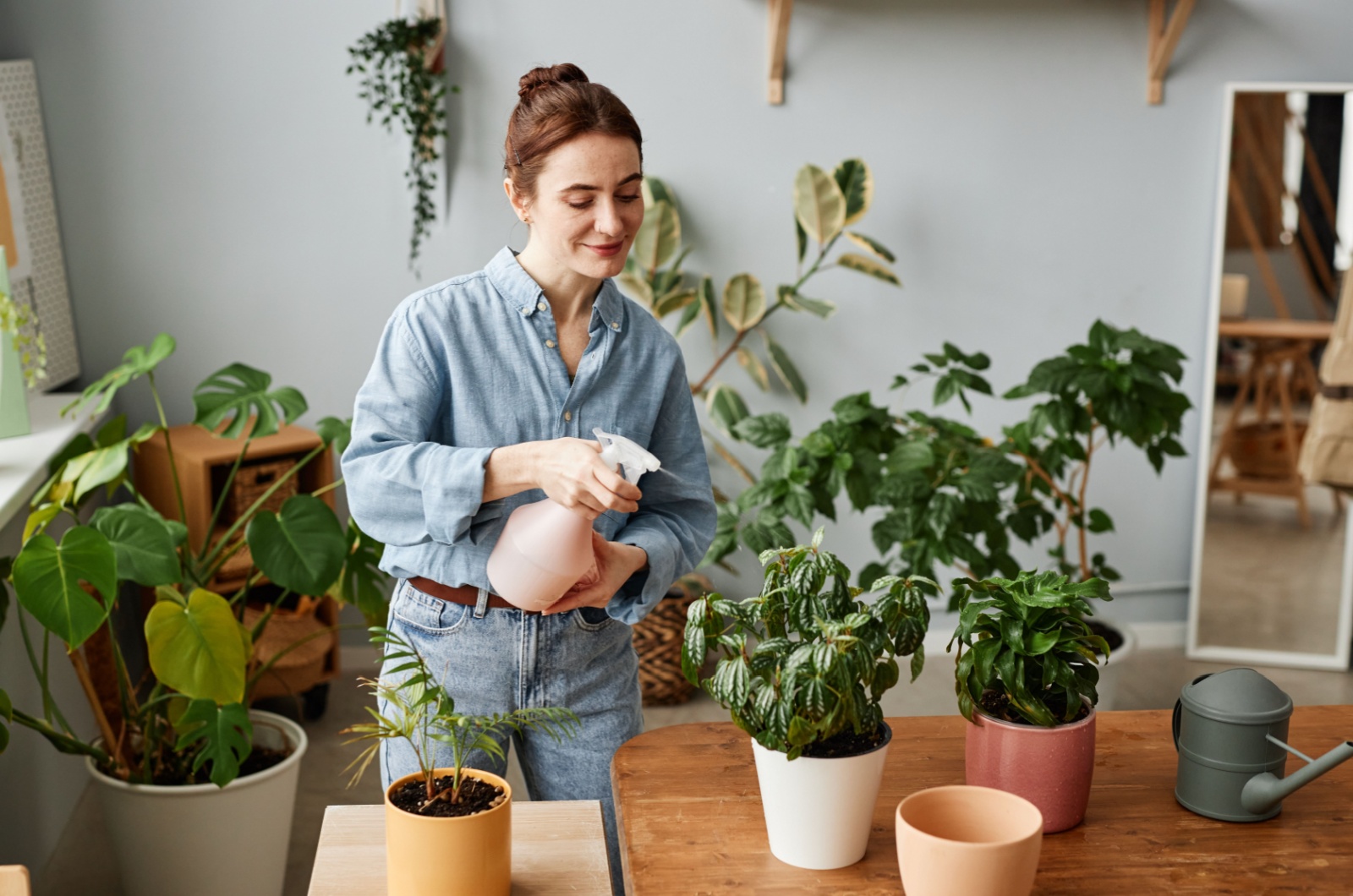 woman taking care of plants