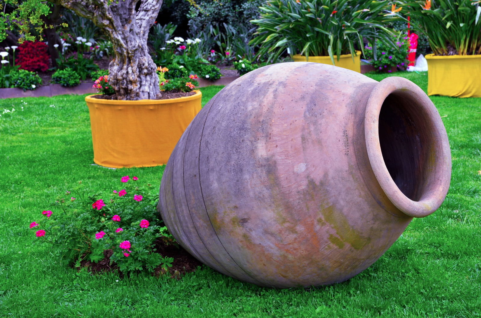 big urn on lawn in garden