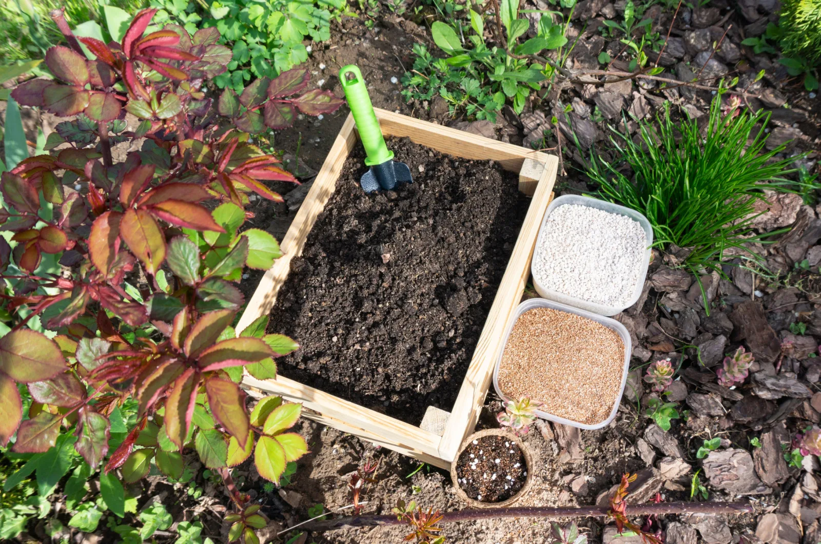 compost, manure, soil and sand in garden