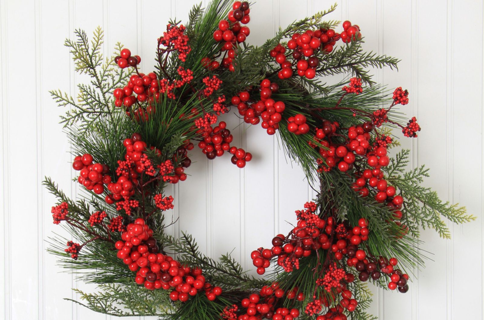 holly wreath on the white wall