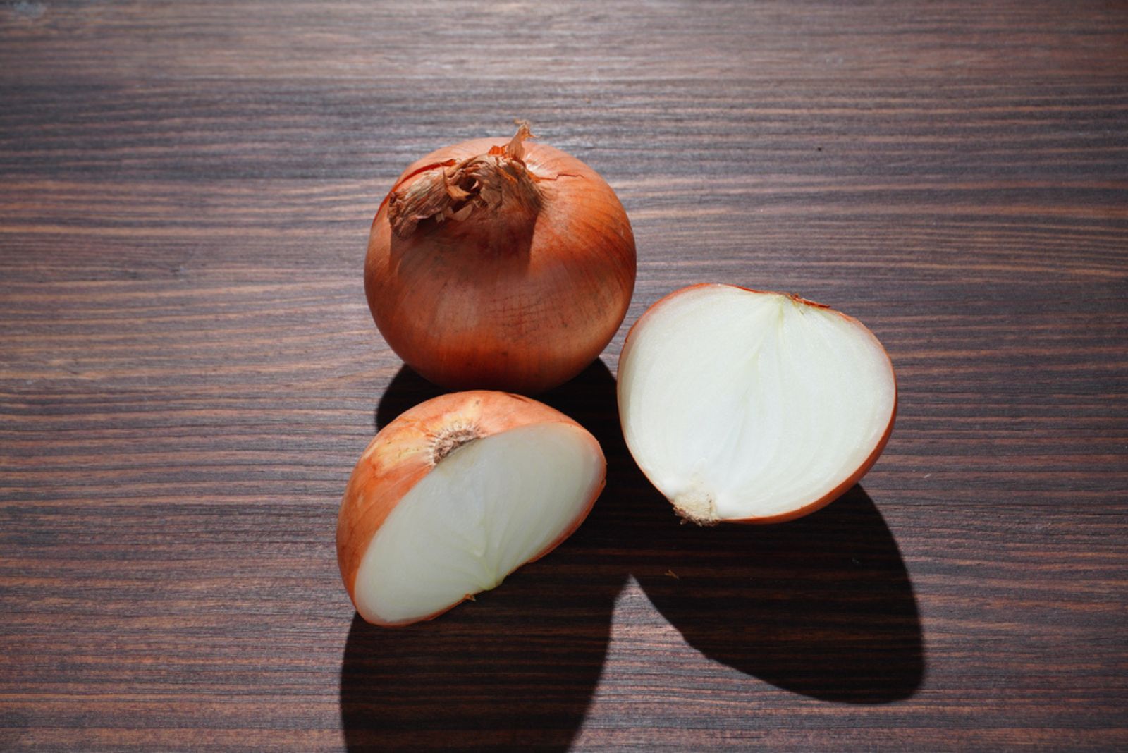 fresh onion on a brown background