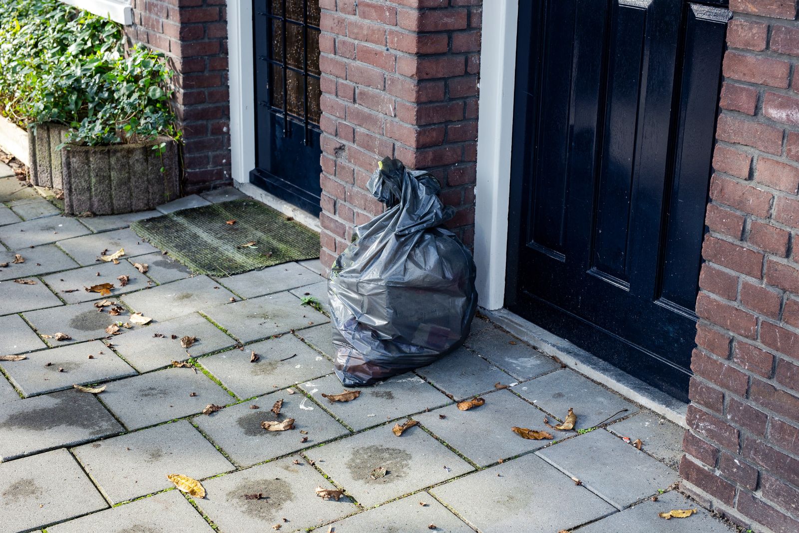 garbage bag in front of the house door