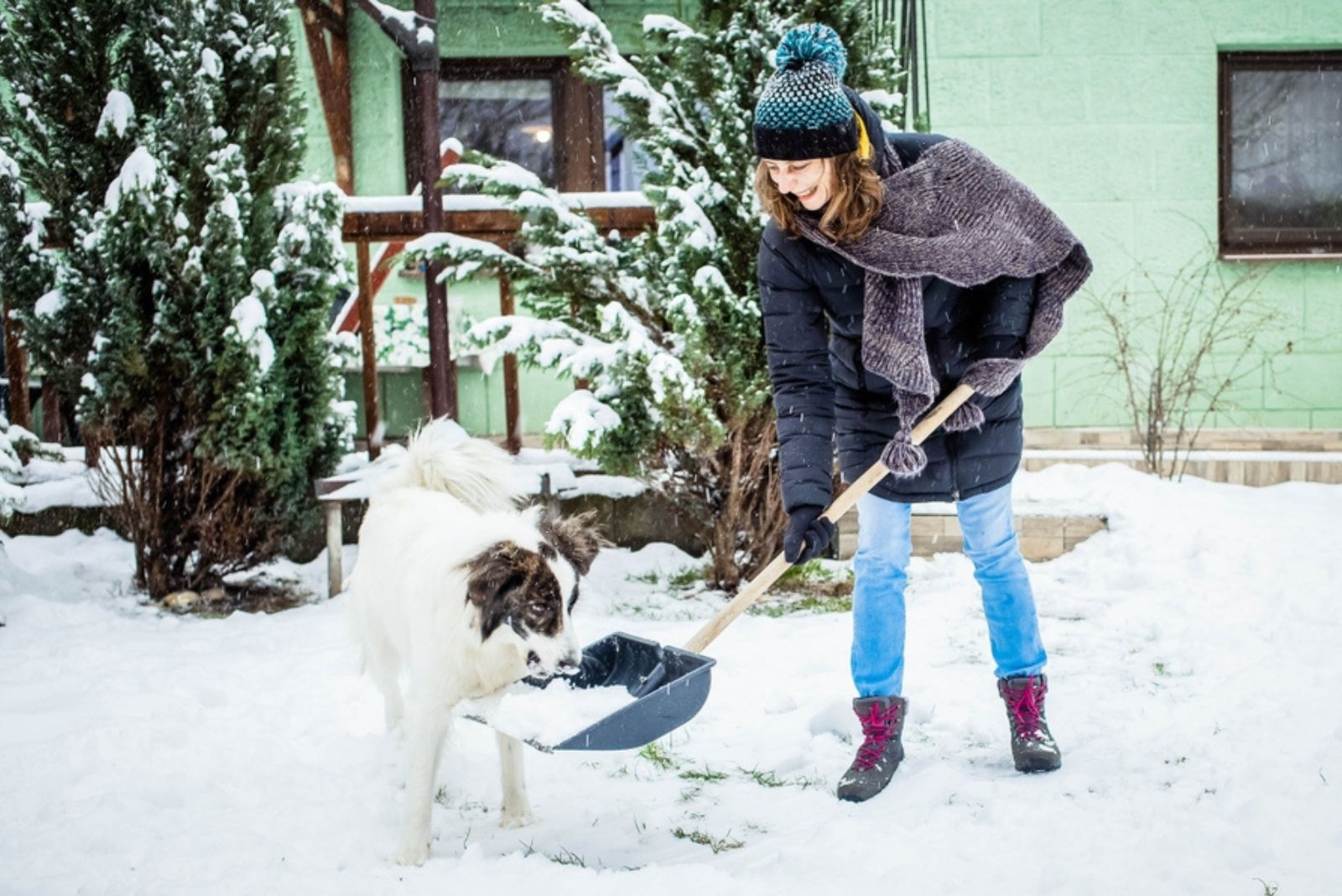 woman shoveling the snow