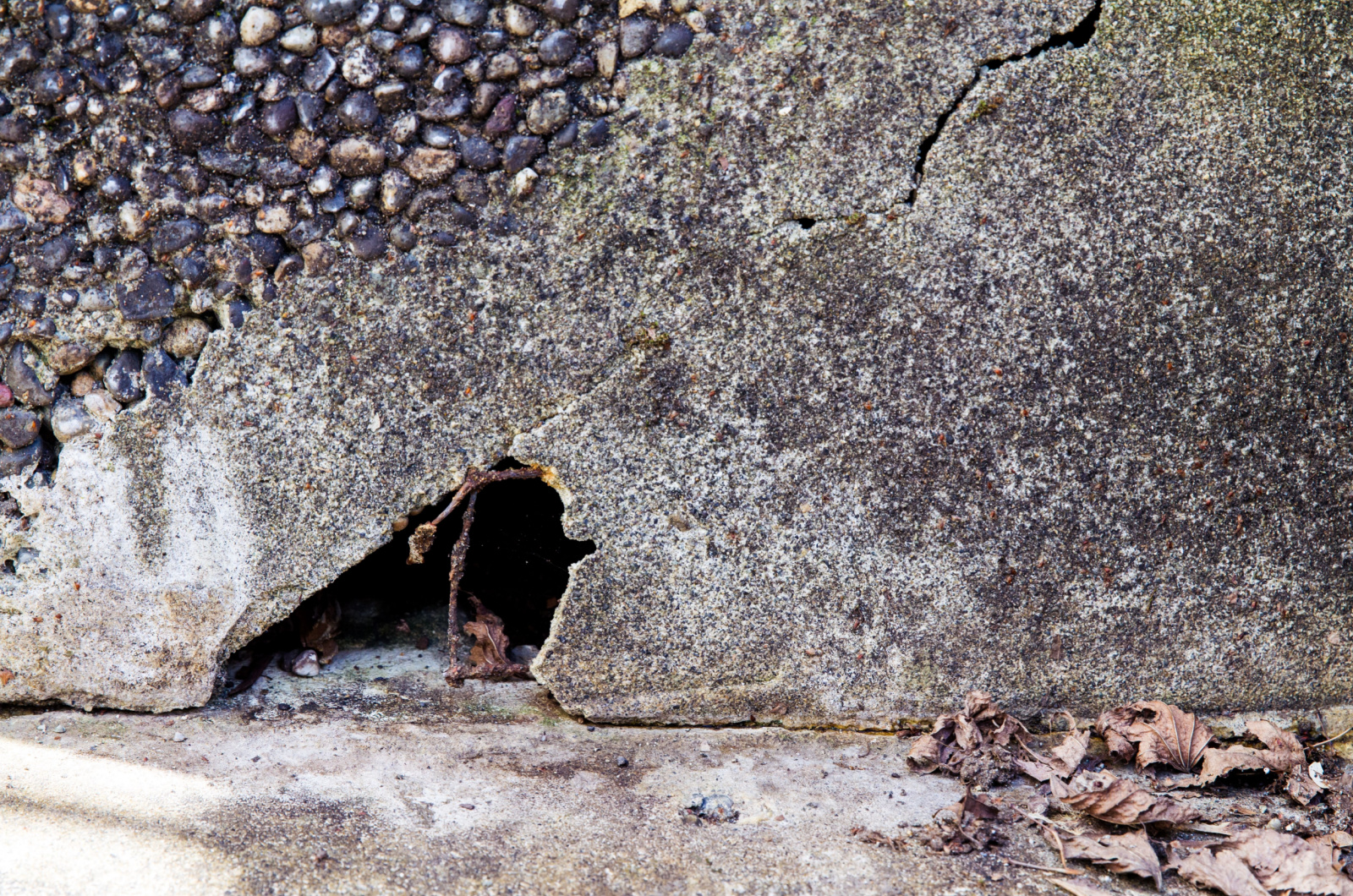 Hole under a concrete step