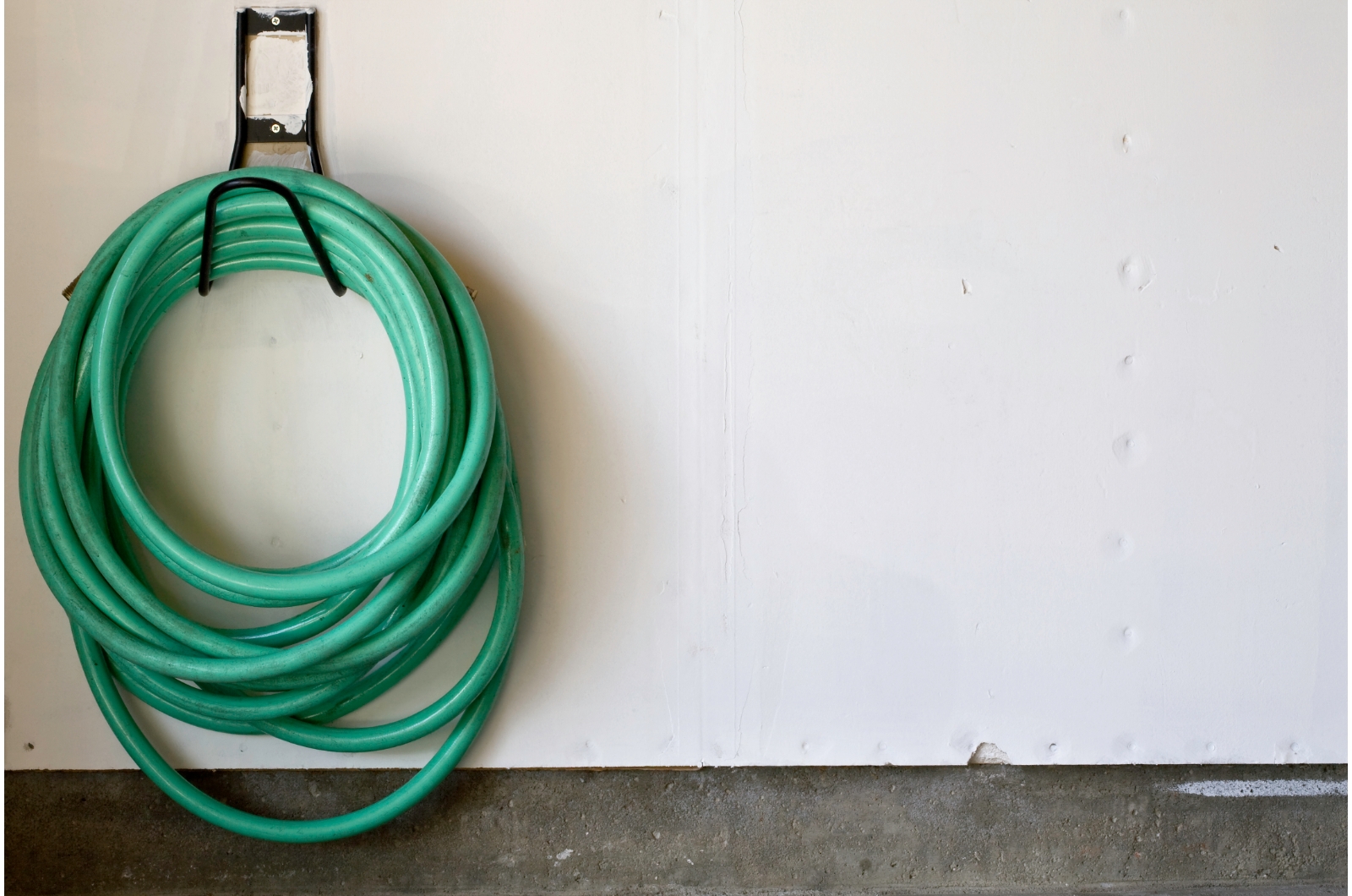 garden hose hanging on the wall