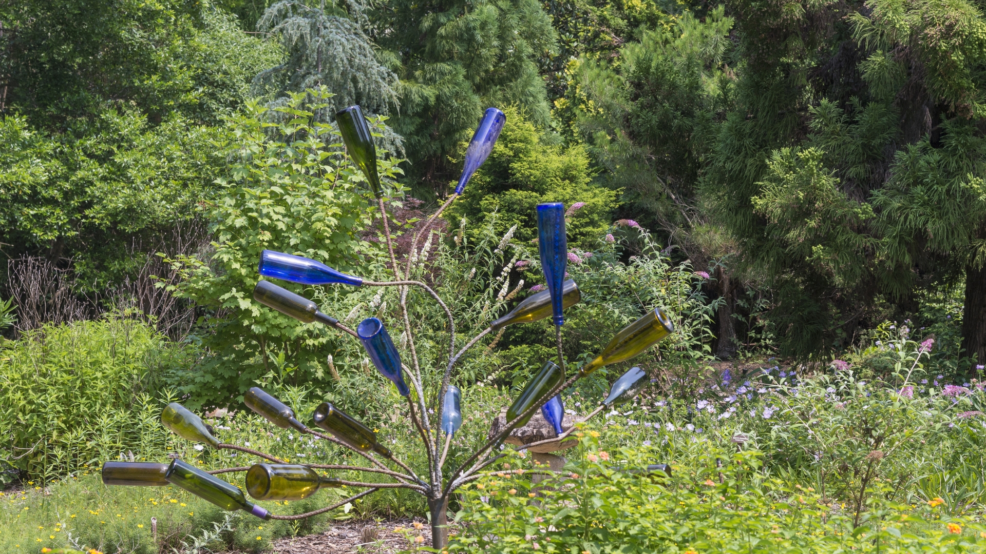 bottle art instalation in garden