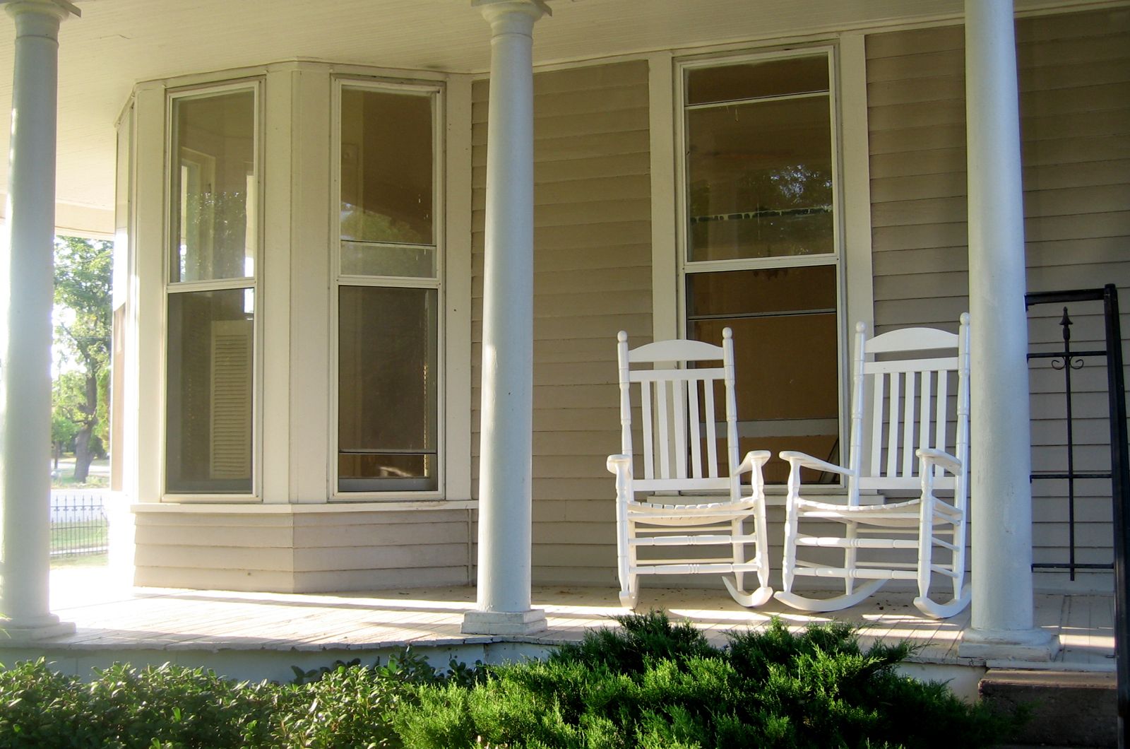 front porch with rocking chairs