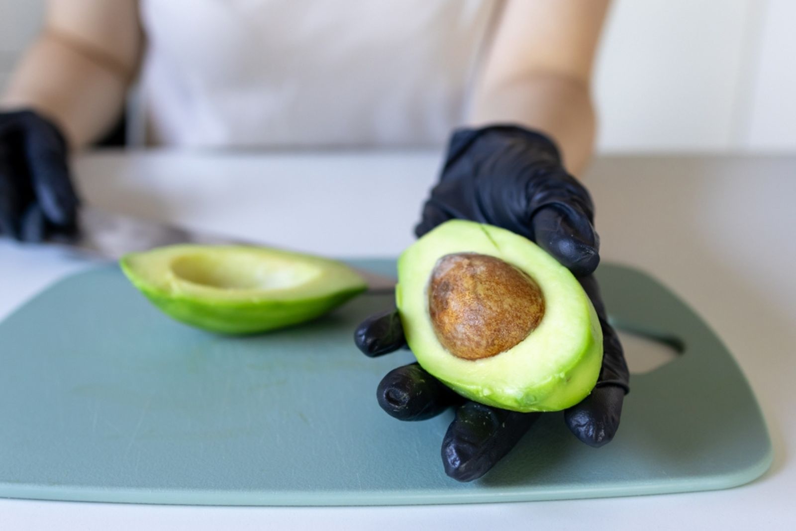 ripped avocado in hand