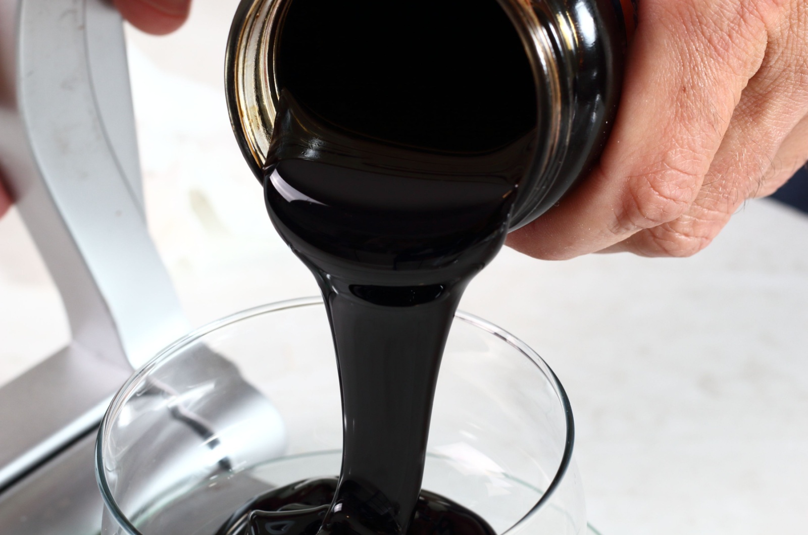 pouring blackstrap molasses