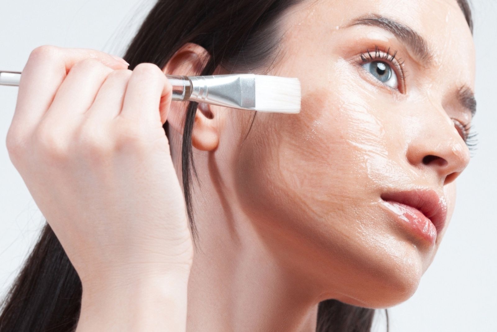 woman applying face mask