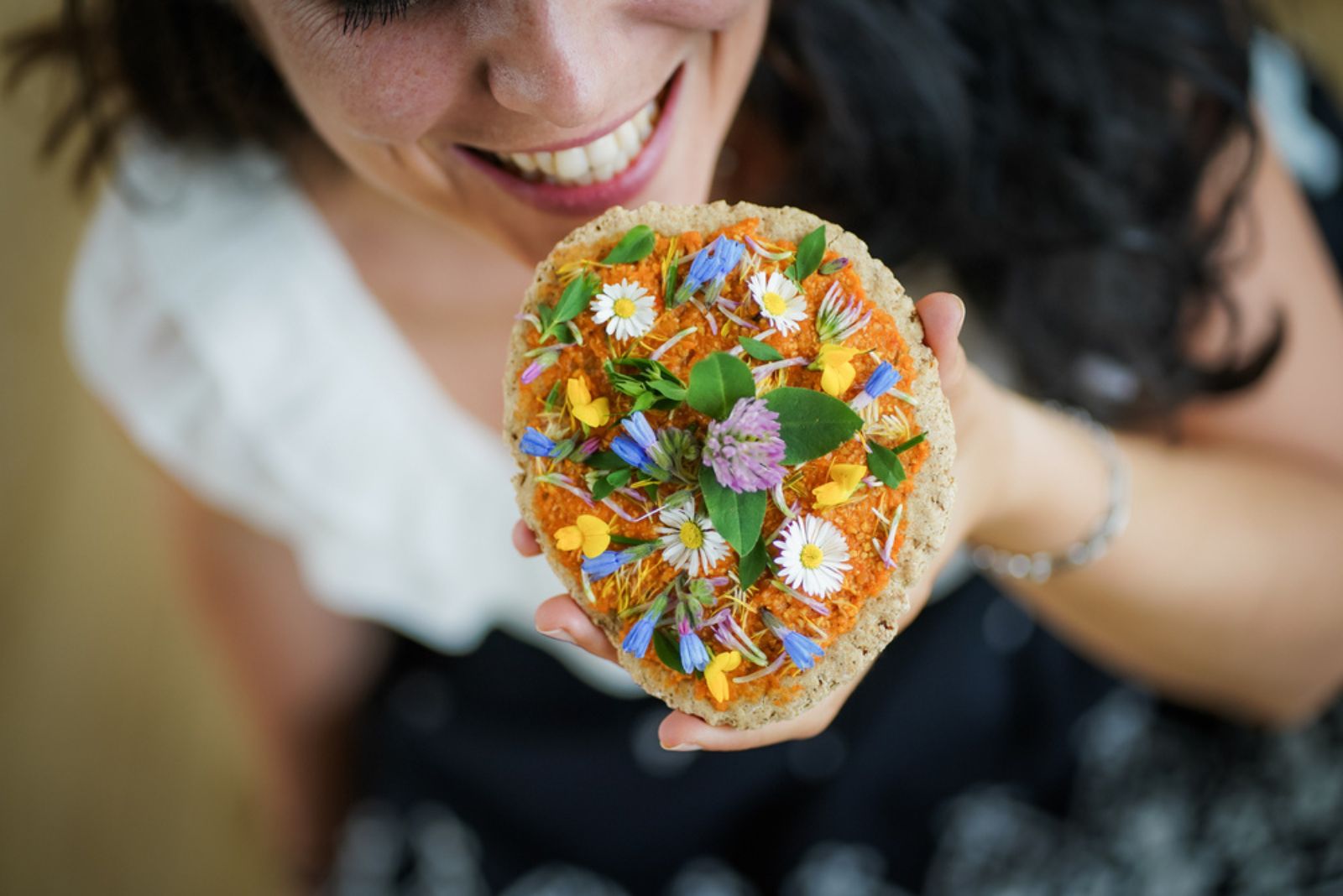 woman eating dandelion bread