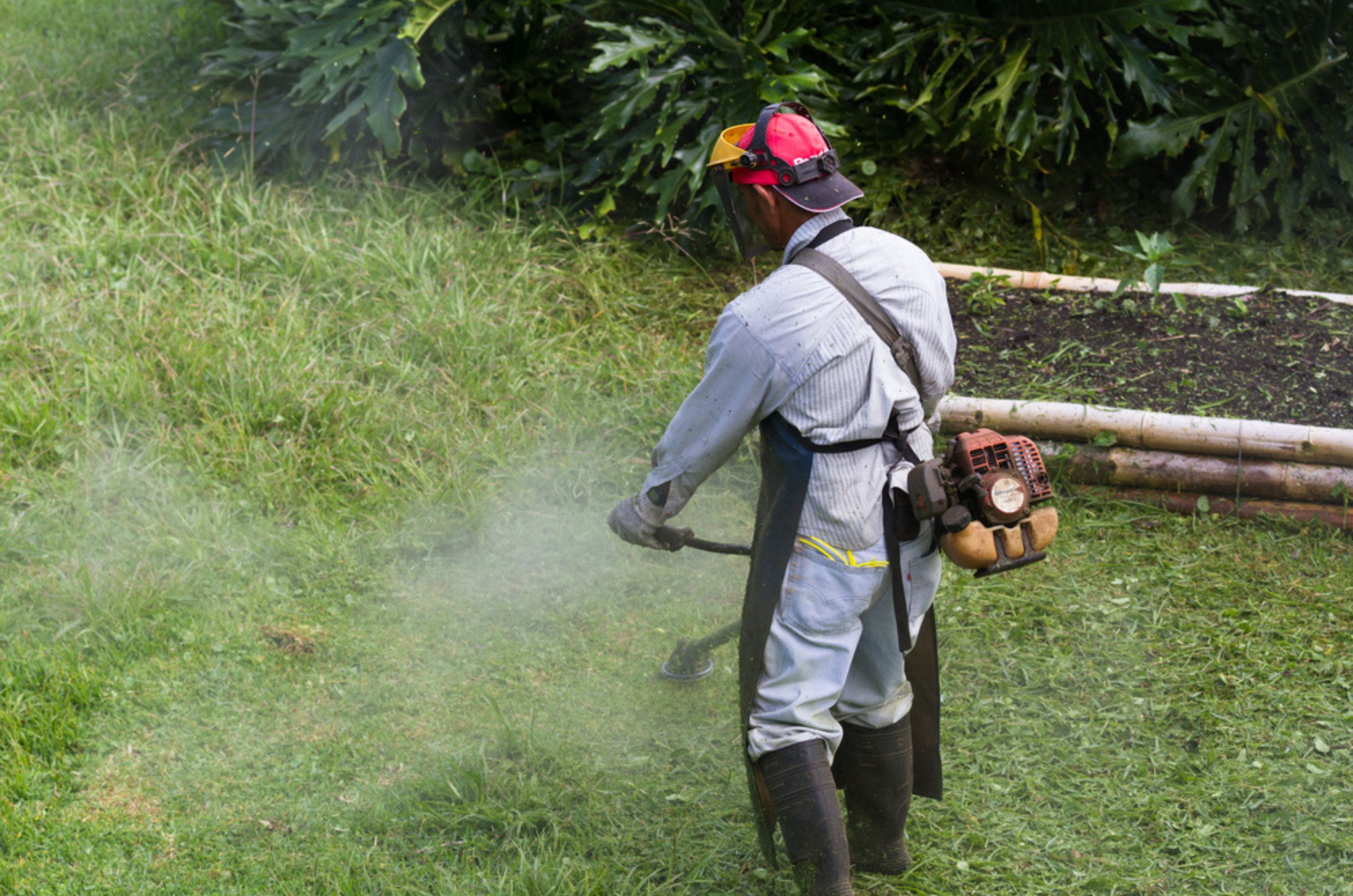 man with a weed whacker