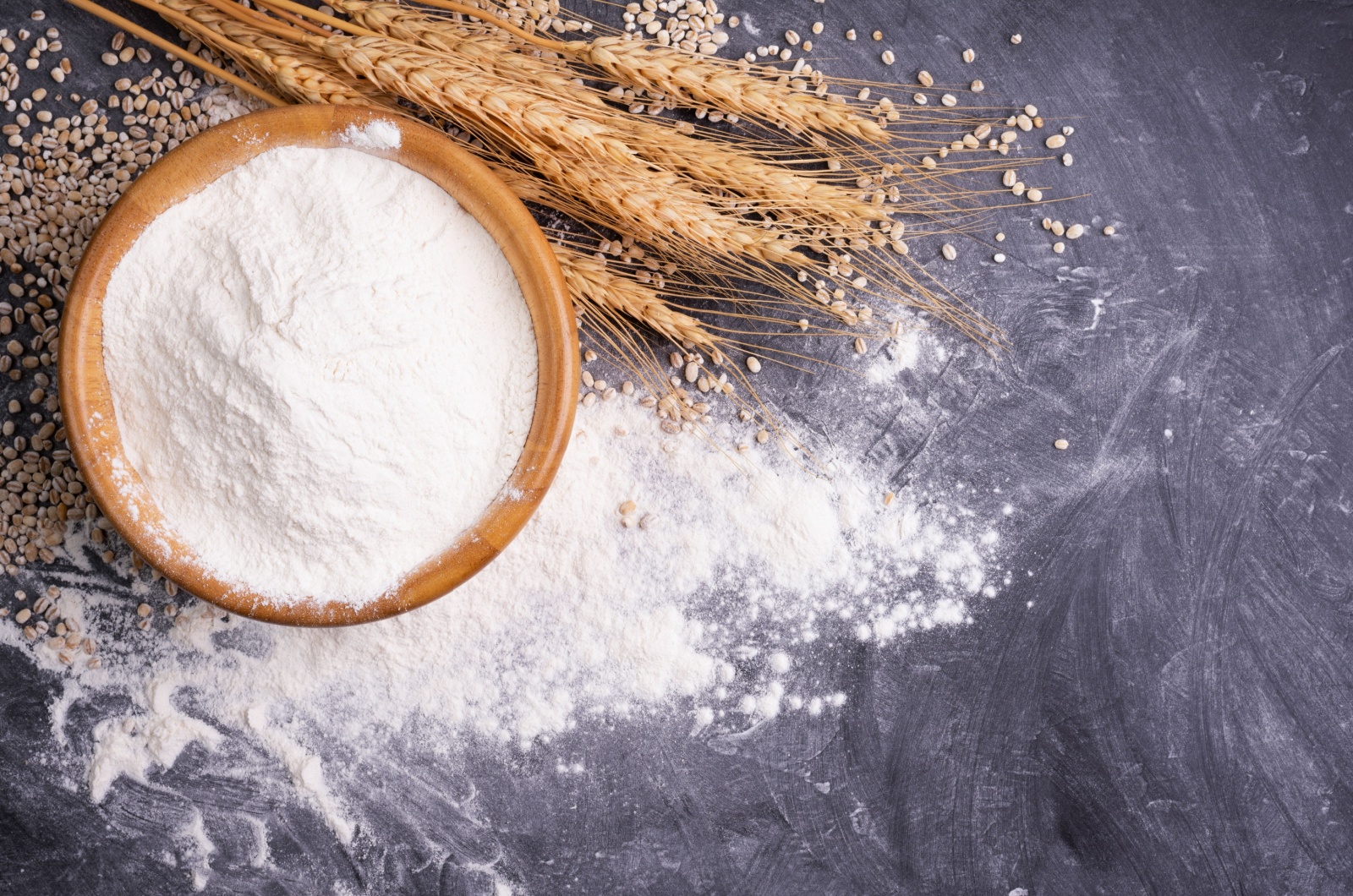 Wheat flour in a wooden bowl