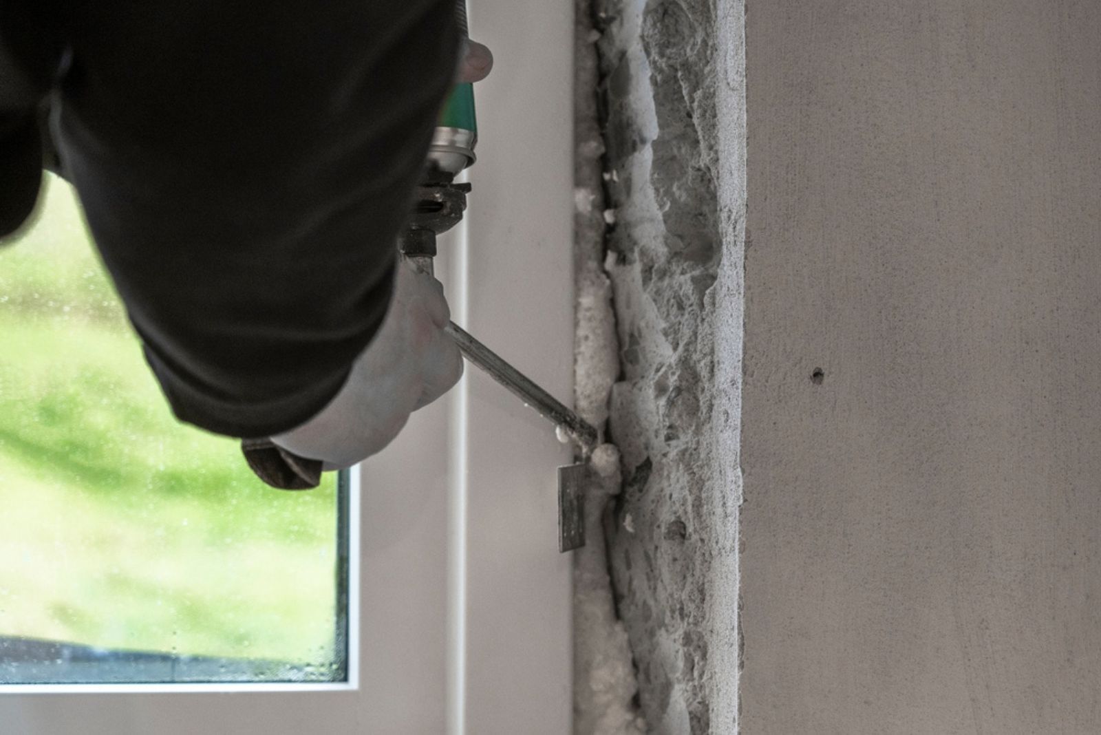 A man foaming a newly installed window