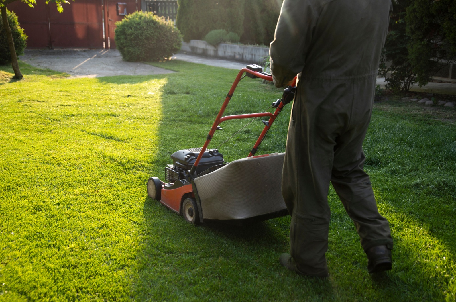 Mowing the grass with a lawn mower