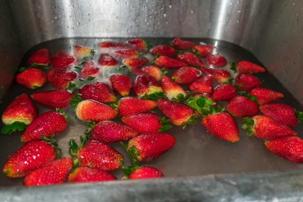 pickled strawberries in water for disinfection