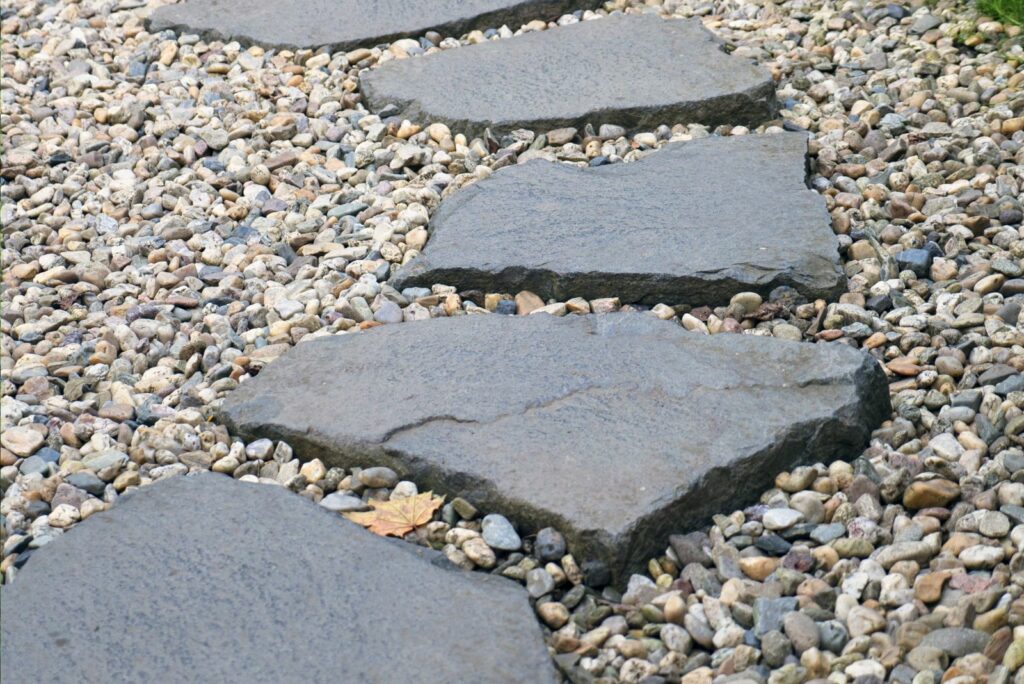 Path of plated stones on gravel bed