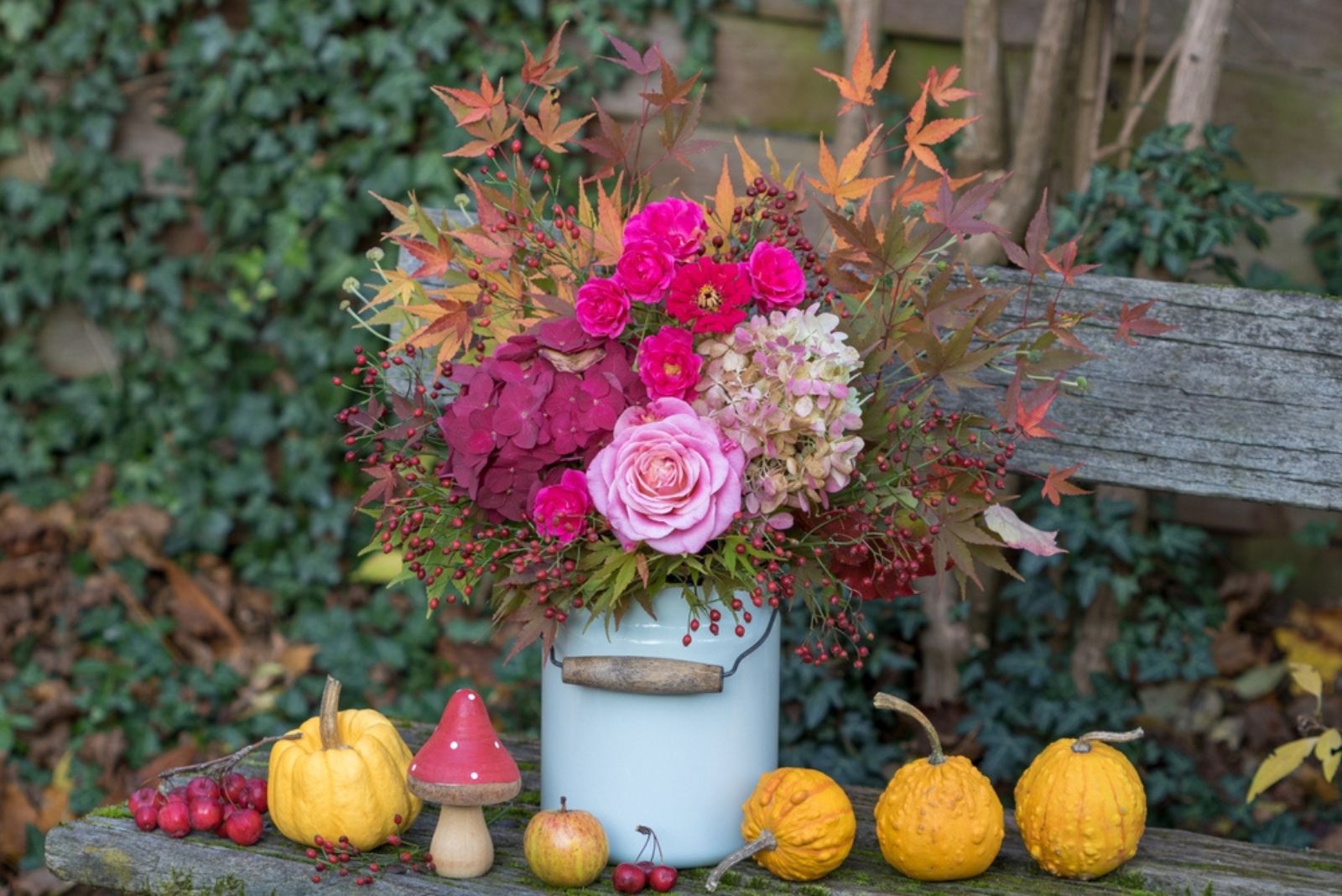 bouquet of flowers in a vintage milk jug