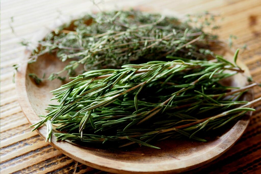 rosemary in a brown bowl