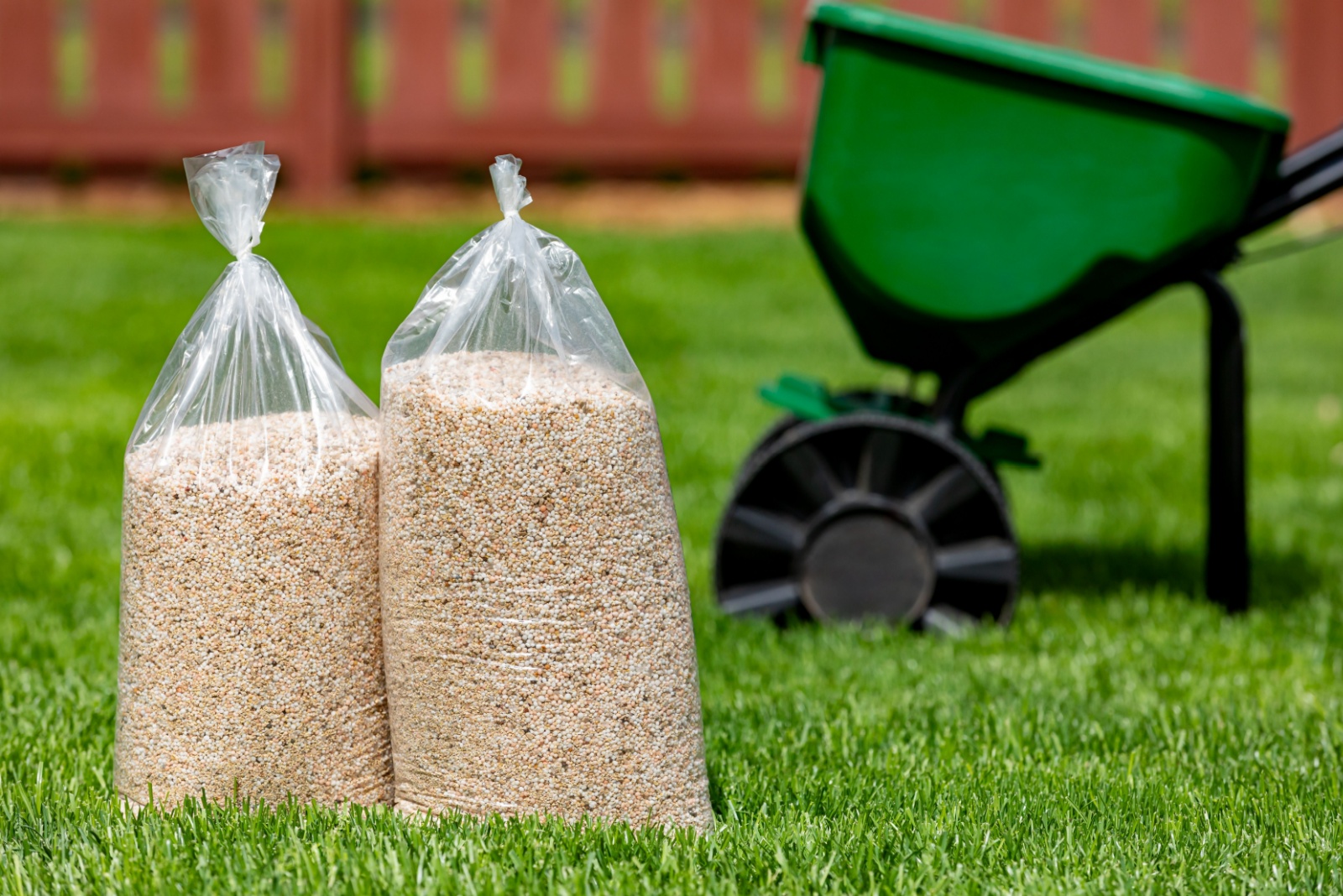 bags of fertilizer on lawn