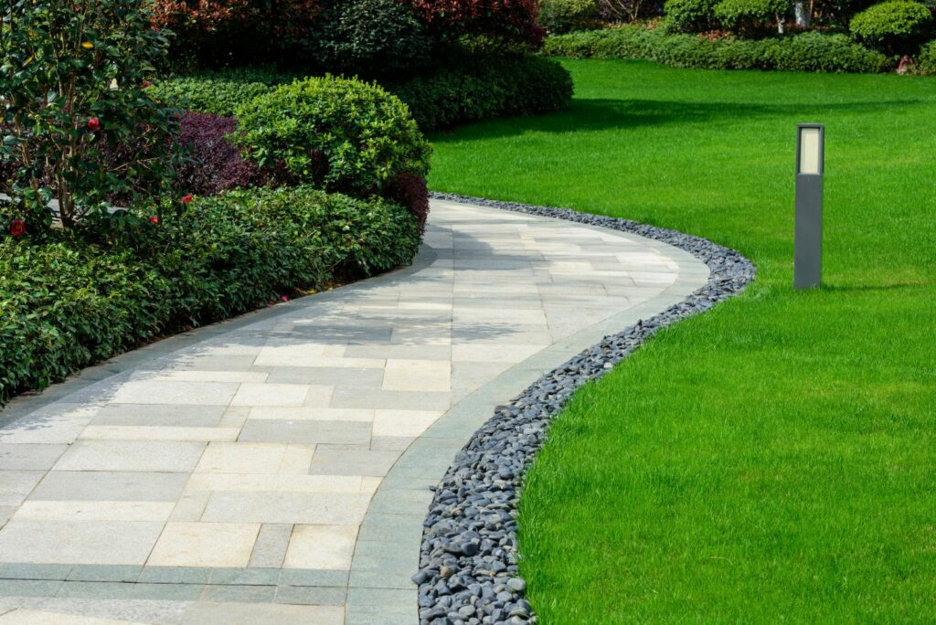 stone path in a green yard