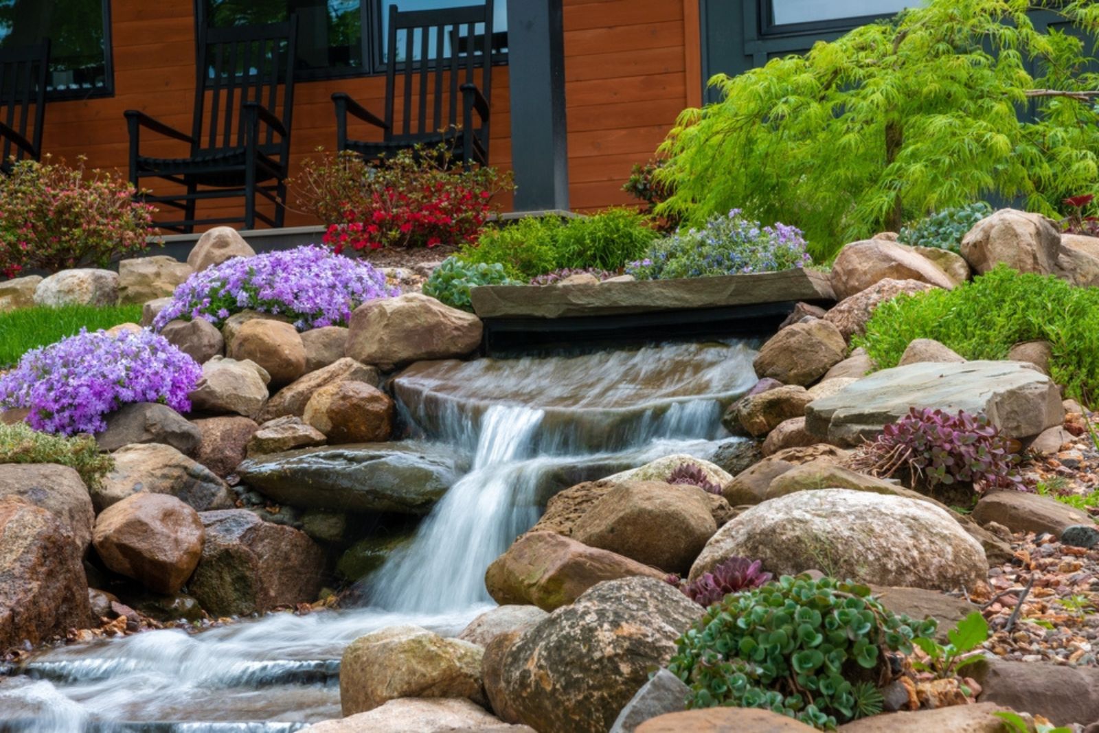 waterfall in garden with rocks