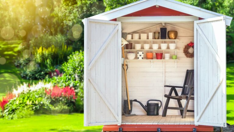 Garden shed filled with gardening tools.