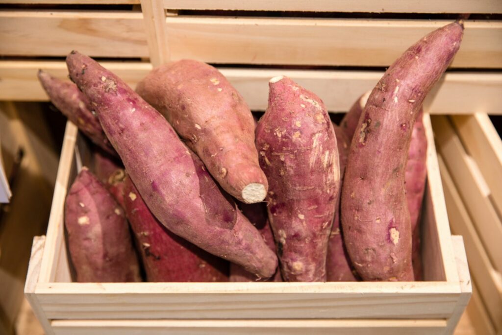 sweet potatoes in a wooden box