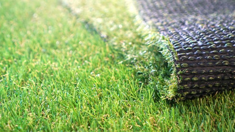 Greenering with artificial grass. Artificial turf background.