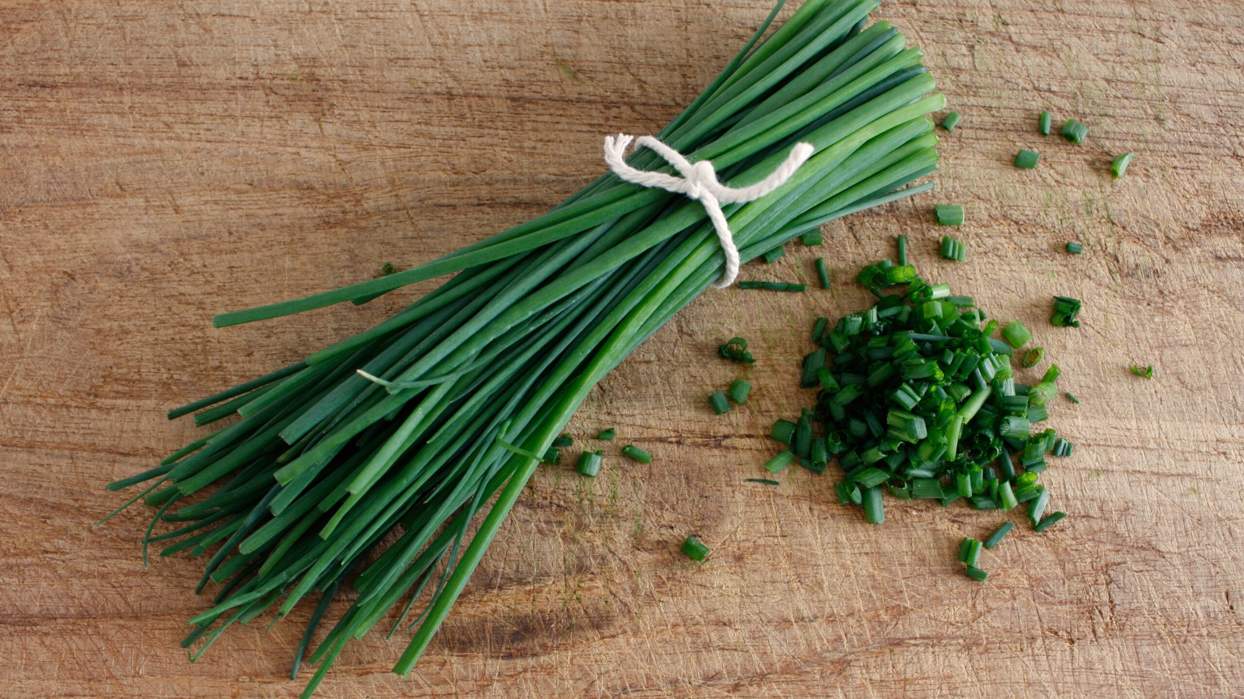 chives on a wooden surface