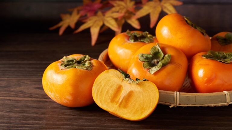 Japanese persimmons with wood grain background