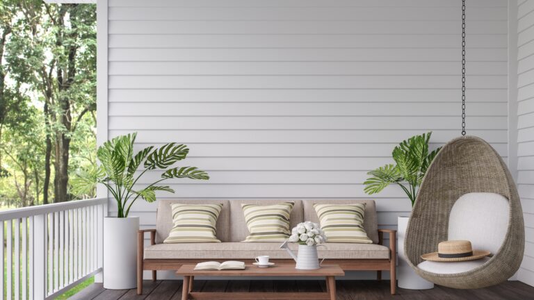 Vintage terrace with nature view 3d render, There are old wooden floor and white plank wall,decorate with wood,fabric and rattan furniture,overlooking to the green garden background