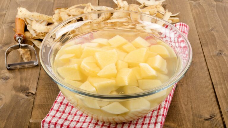 peeled potato in water