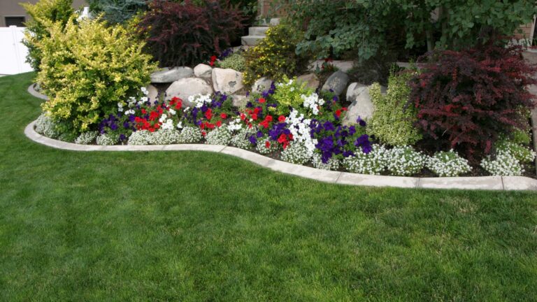 Landscaped Yard with flowers shrubs rocks