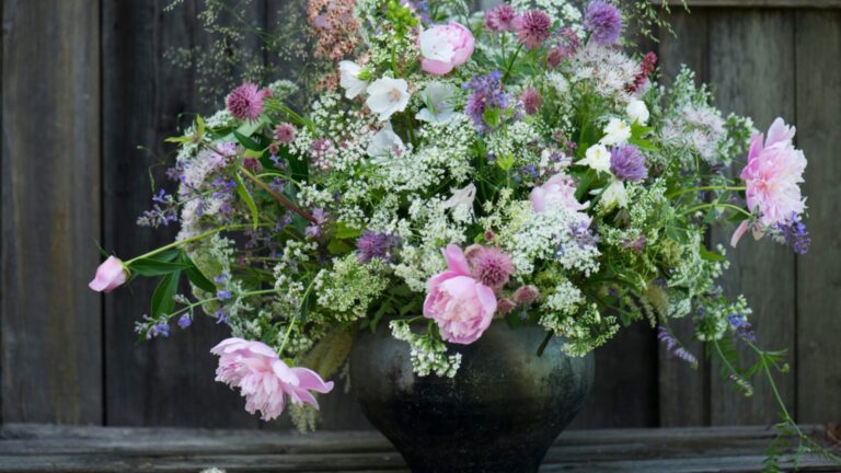 a bouquet of freshly cut perennial flowers in a vase
