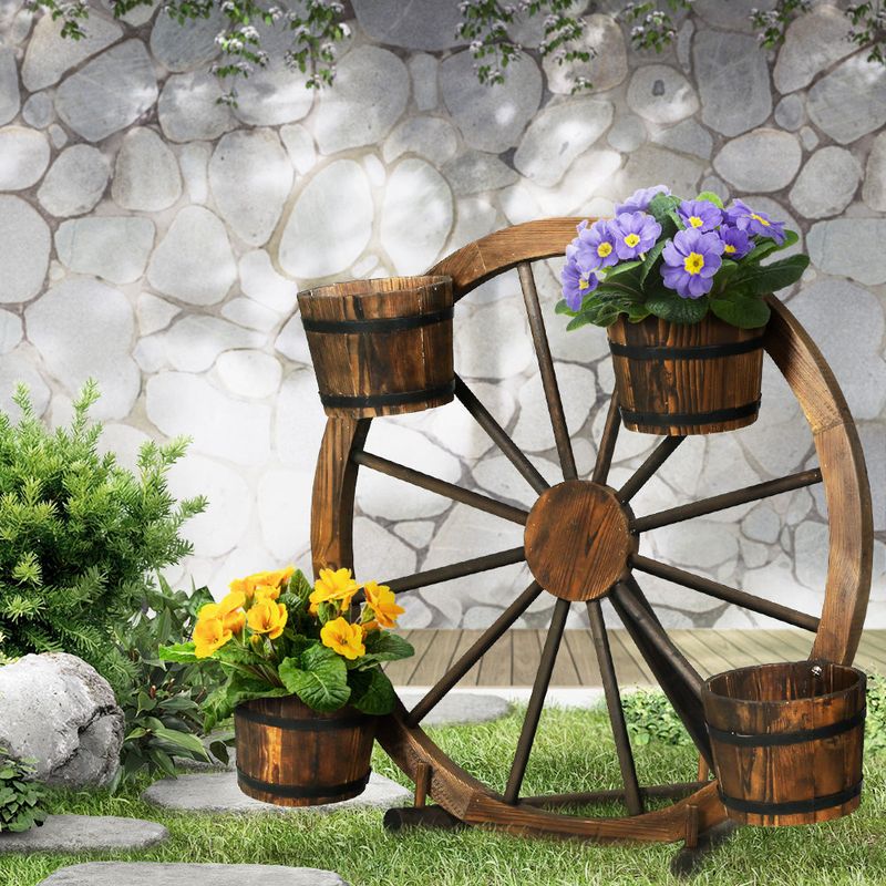 Decorative Wagon Wheels Propped Against Fences