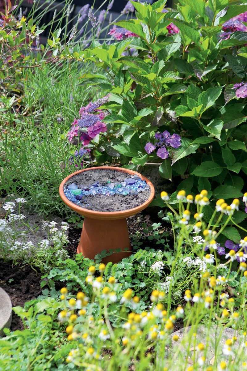 Old Teapots Convert Into Pollinator Waterers