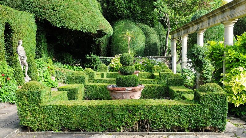 Overcrowded Garden Statuary Creating Visual Clutter